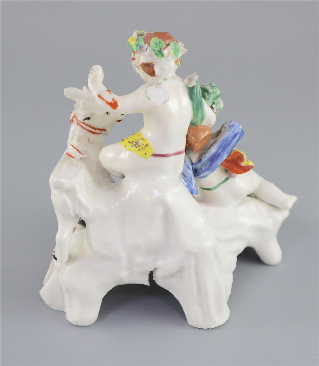 A Vauxhall porcelain group of two Bacchanalian cherubs and a goat, c.1760-5, 14.5cm high